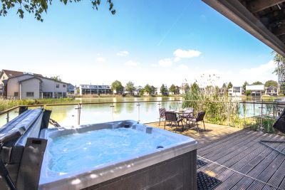 View across the decking and Hot Tub of Howells Mere 27