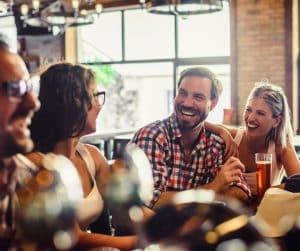 friends enjoying a drink in a pub